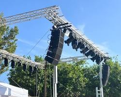 Professional outdoor concert sound system deployment by Stonehenge Sound, featuring line array speakers for large-scale live event audio production in Connecticut.